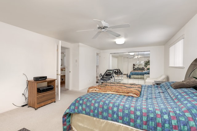 bedroom featuring carpet floors, ceiling fan, and a closet