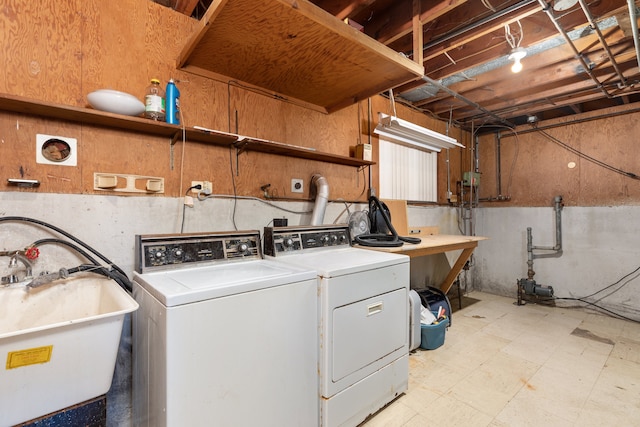 washroom featuring sink and separate washer and dryer