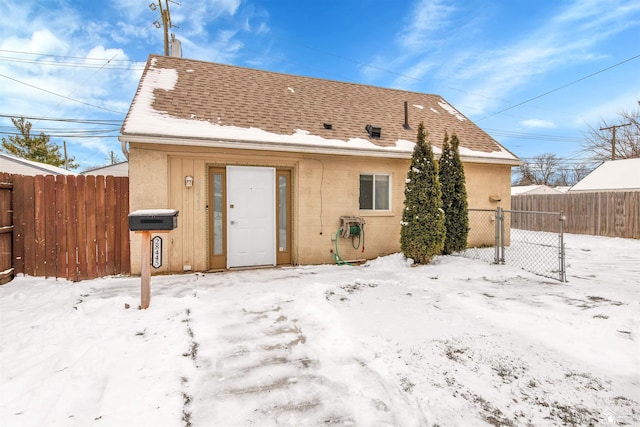 view of snow covered house