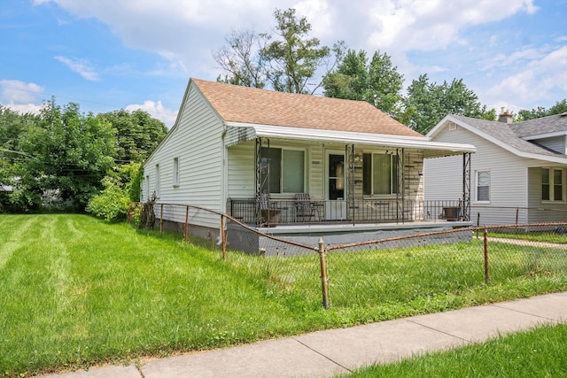 view of front of house with a porch and a front yard