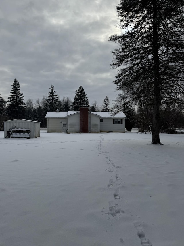 view of yard layered in snow