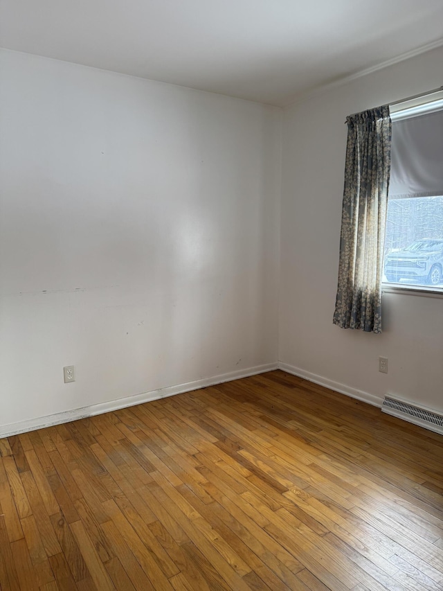 spare room featuring light wood-type flooring