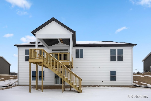 view of snow covered house