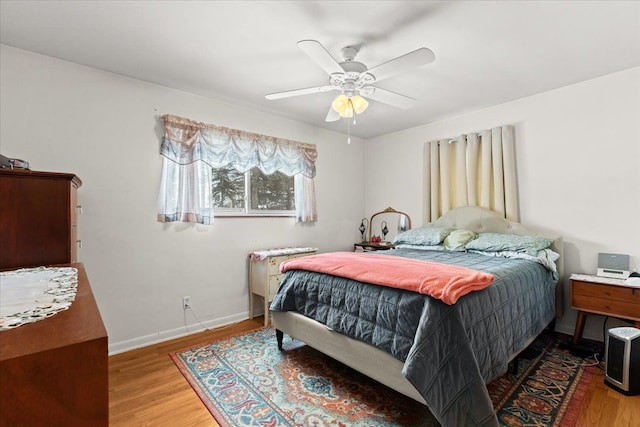 bedroom featuring light wood-type flooring and ceiling fan