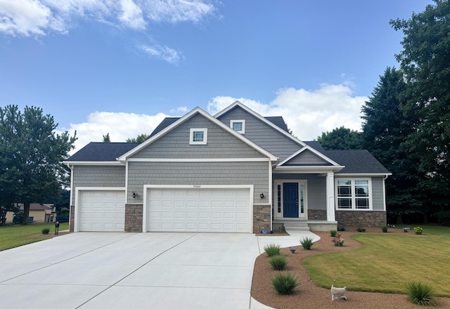 craftsman-style house with a front yard and a garage