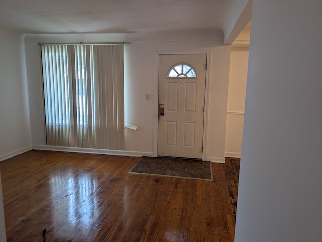 foyer entrance with dark hardwood / wood-style floors