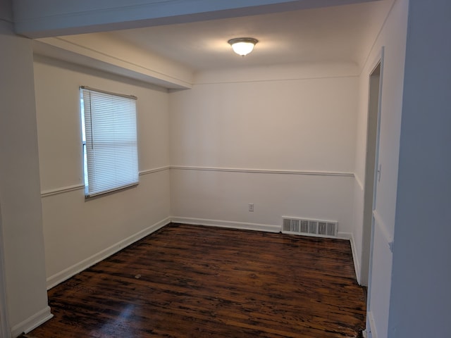 empty room featuring dark hardwood / wood-style floors