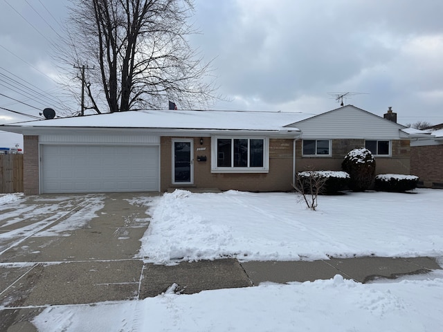 single story home with a garage