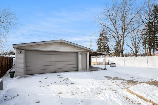 view of snow covered garage