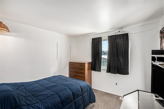 carpeted bedroom featuring baseboards