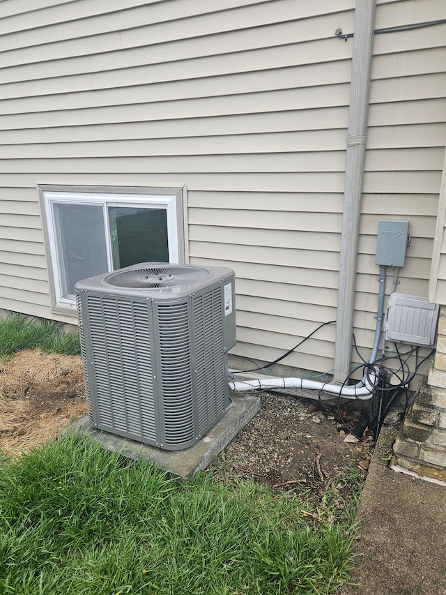 exterior details featuring cooling unit