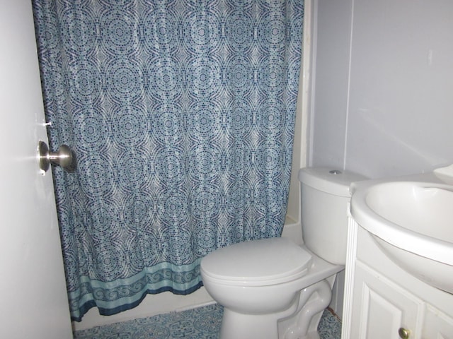 bathroom featuring toilet and vanity