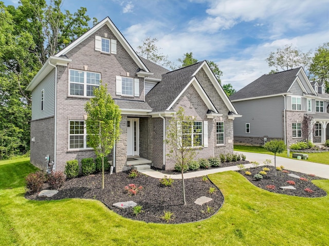 craftsman-style house featuring a front lawn