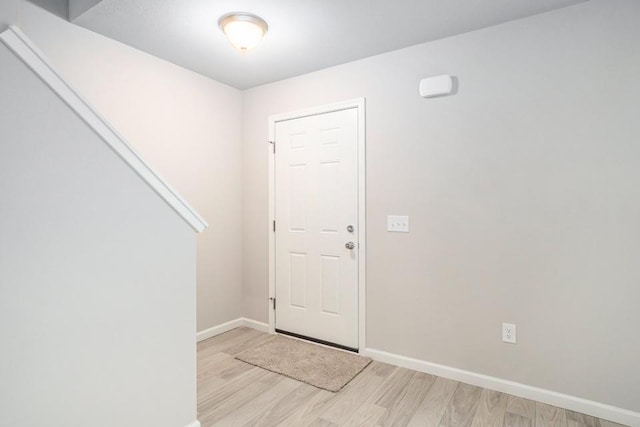 entryway with light hardwood / wood-style floors