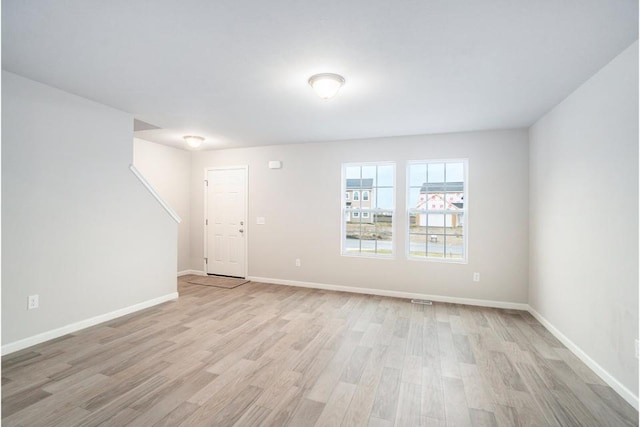 empty room with light wood-type flooring