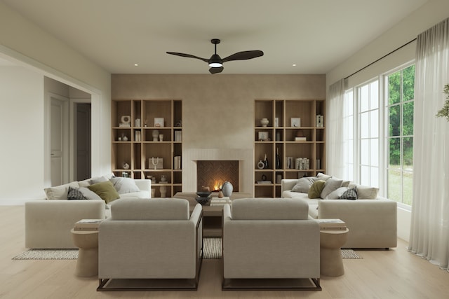 841 Quarry, Rochester Hills, MI 48306 - sitting room featuring light wood finished floors, ceiling fan, built in shelves, and a lit fireplace