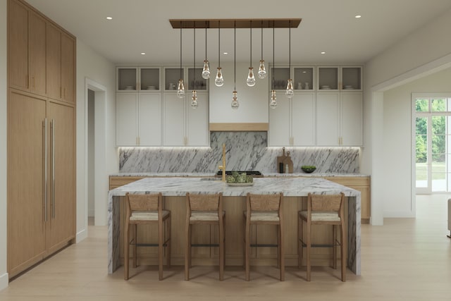 841 Quarry, Rochester Hills, MI 48306 - kitchen with light stone counters, decorative backsplash, glass insert cabinets, and a kitchen island with sink