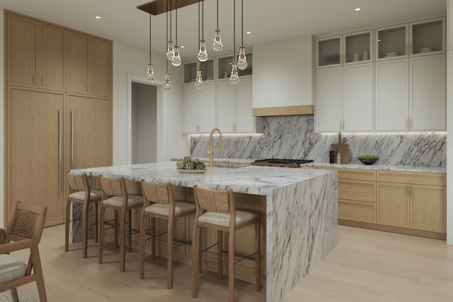 841 Quarry, Rochester Hills, MI 48306 - kitchen featuring a kitchen island with sink, a sink, custom range hood, light wood-style floors, and backsplash