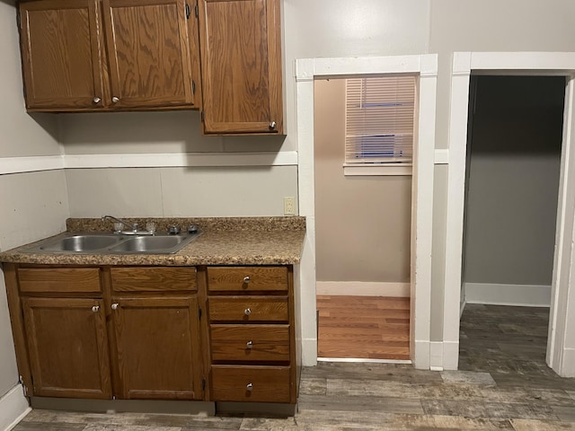 kitchen featuring dark hardwood / wood-style flooring and sink