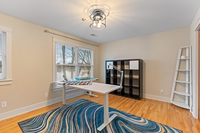 office area with hardwood / wood-style floors