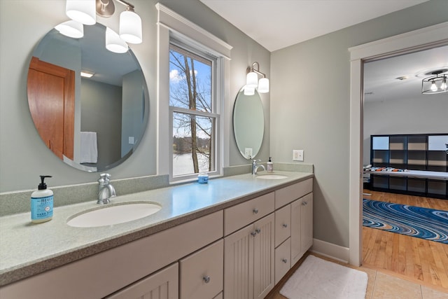 bathroom featuring tile patterned flooring, vanity, and a wealth of natural light