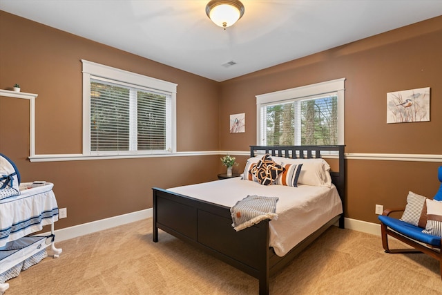 bedroom featuring light carpet