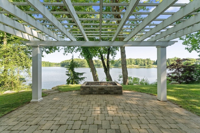 view of patio / terrace featuring a pergola and a water view