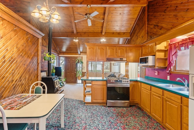 kitchen with gas range, vaulted ceiling with beams, sink, wood ceiling, and ceiling fan with notable chandelier