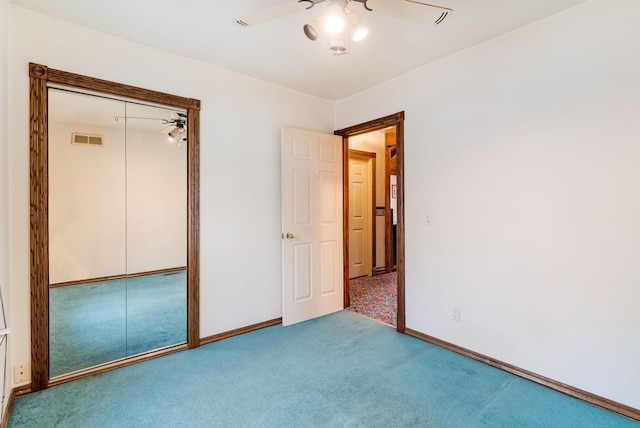 unfurnished bedroom with ceiling fan, a closet, and light colored carpet