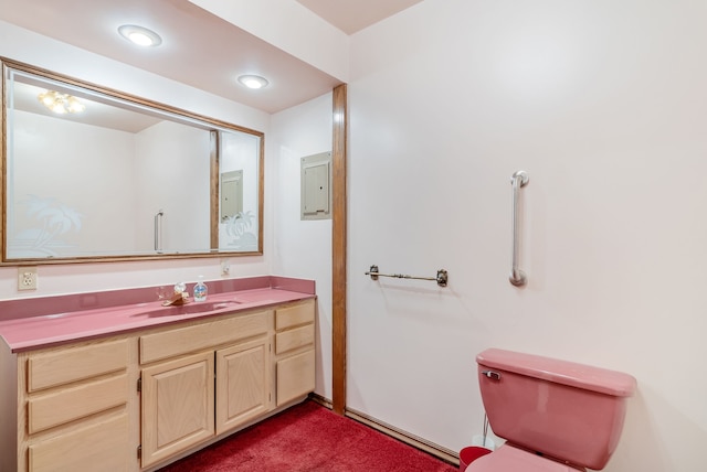 bathroom featuring toilet and vanity