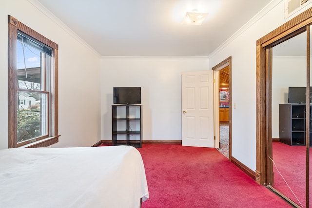 bedroom with carpet floors, multiple windows, and ornamental molding