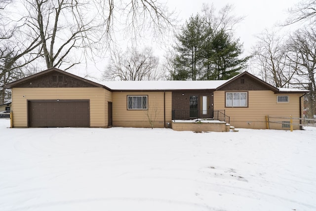 single story home featuring a garage