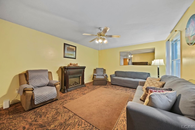 carpeted living room with ceiling fan