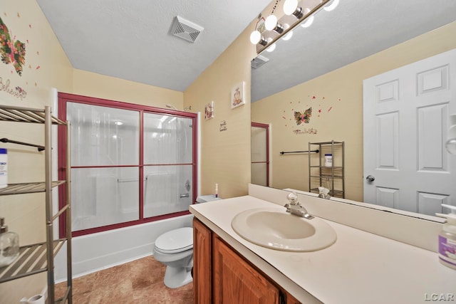 full bathroom with vanity, toilet, enclosed tub / shower combo, and a textured ceiling