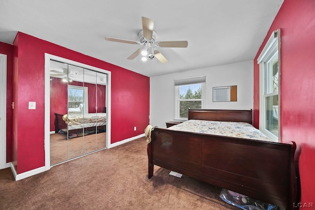 carpeted bedroom featuring ceiling fan and a closet