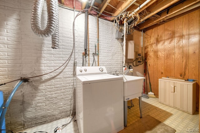 laundry room featuring washer / clothes dryer and wood walls