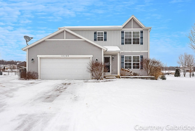 front of property with a garage