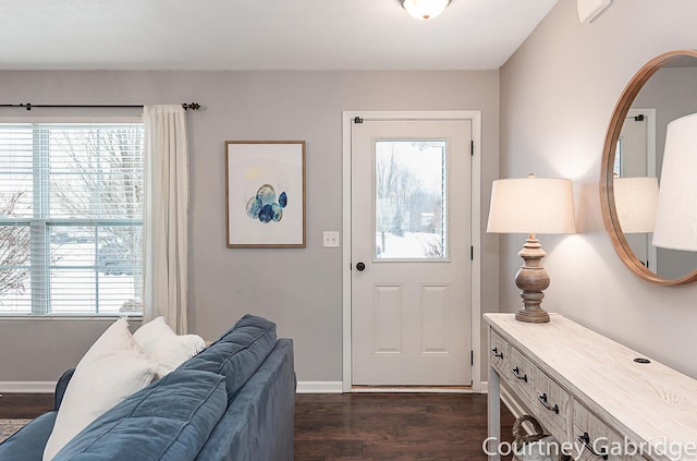 entryway with dark hardwood / wood-style flooring