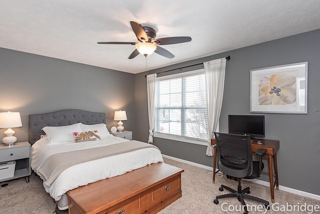 bedroom featuring light colored carpet and ceiling fan