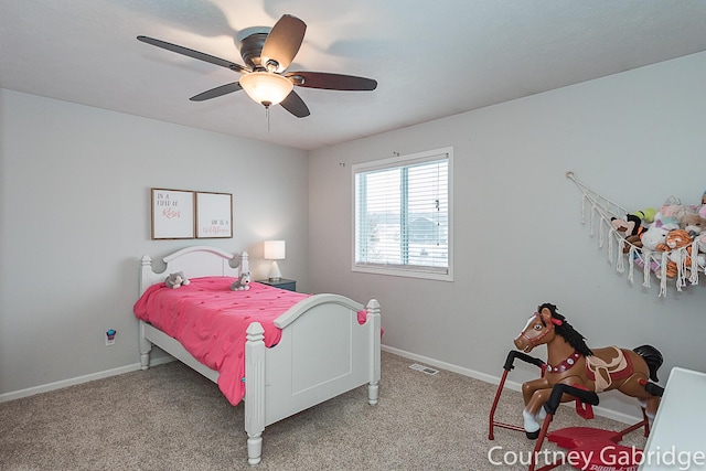 bedroom with light colored carpet and ceiling fan