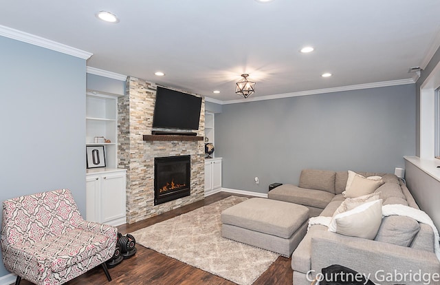 living room with crown molding, built in features, a fireplace, and dark wood-type flooring