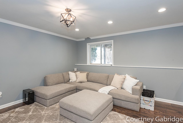 living room featuring a chandelier, wood-type flooring, and ornamental molding