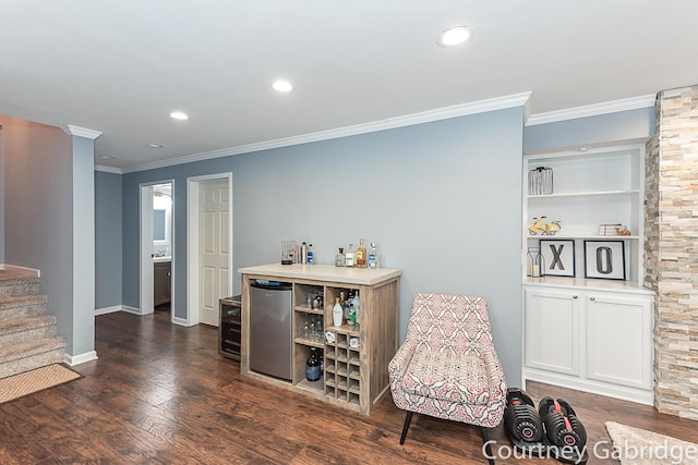 bar with dark hardwood / wood-style flooring, white cabinets, fridge, and ornamental molding