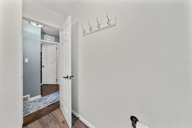 hallway featuring dark hardwood / wood-style floors