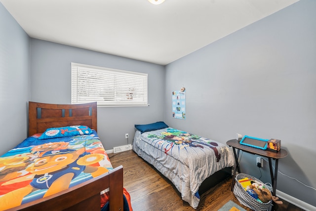 bedroom featuring dark wood-type flooring