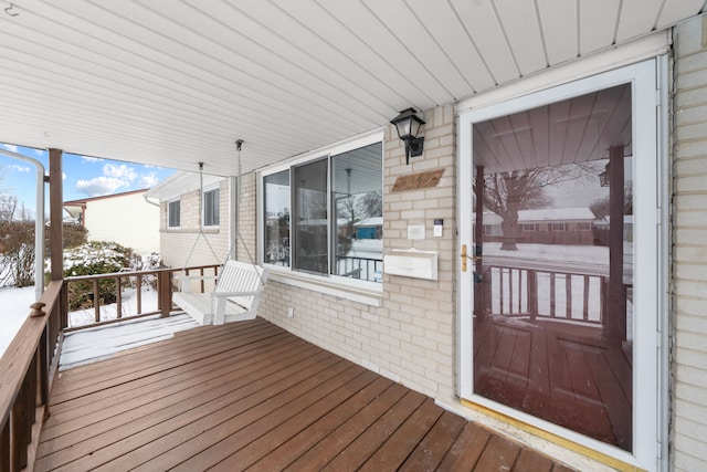 view of snow covered deck