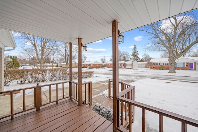 view of snow covered deck