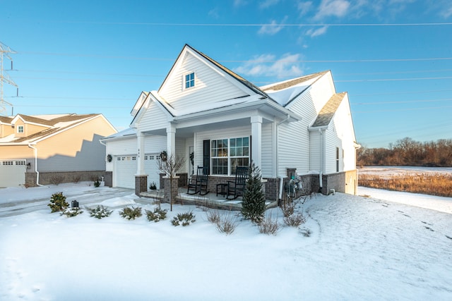 view of front of house with covered porch and a garage