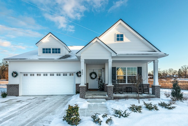 view of front of property with a garage and covered porch