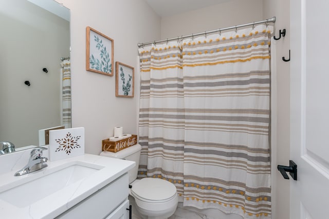 bathroom with toilet and vanity